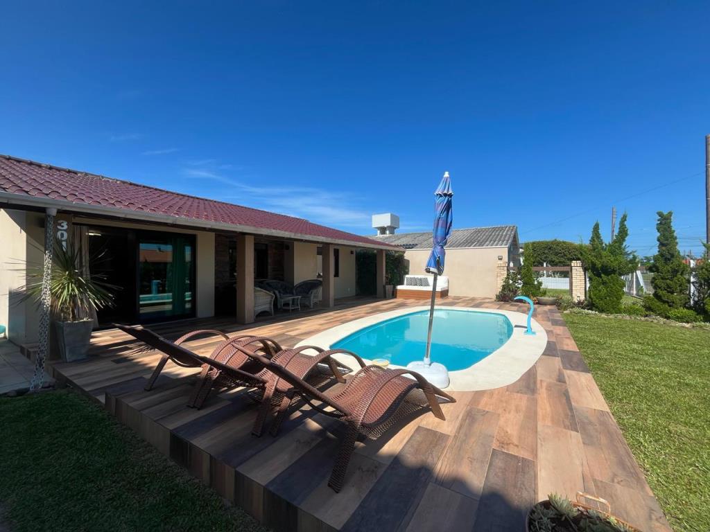 Casa Térrea com 170m² e 4 dormitórios no bairro ARPOADOR em Xangri-lá para Comprar